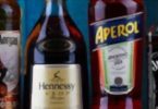 Bottles of assorted global hard liquor brands including Bombay Sapphire