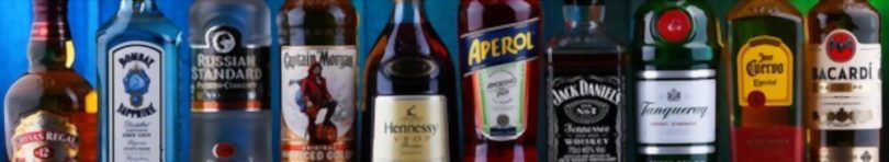 Bottles of assorted global hard liquor brands including Bombay Sapphire
