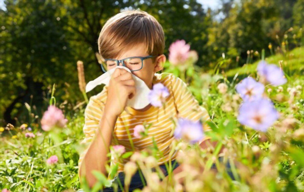 Boy with a runny nose or hay fever symptoms  