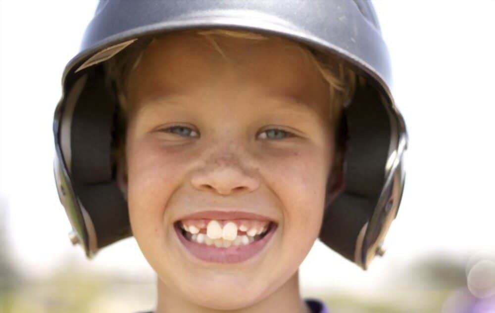 A picture of a boy has buck teeth.