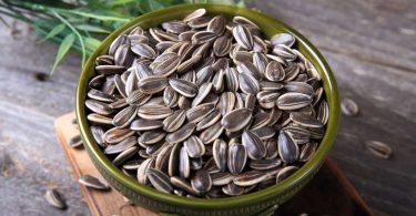 Sunflower seed in bowl which causes sunflower seed allergy.