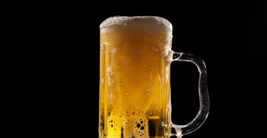 A glass of beer can cause beer allergy in sensitive people.