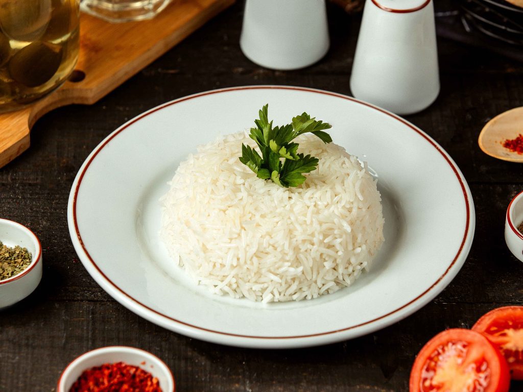 Cooked rice in the bowl gives the concept of rice allergy.